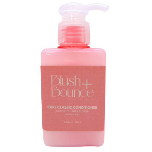 Pink bottle of Blush + Bounce Classic Conditioner on a white background